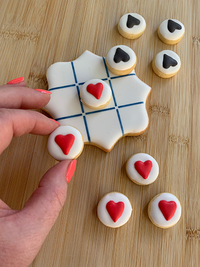 Naughts and crosses themed decorated cookies